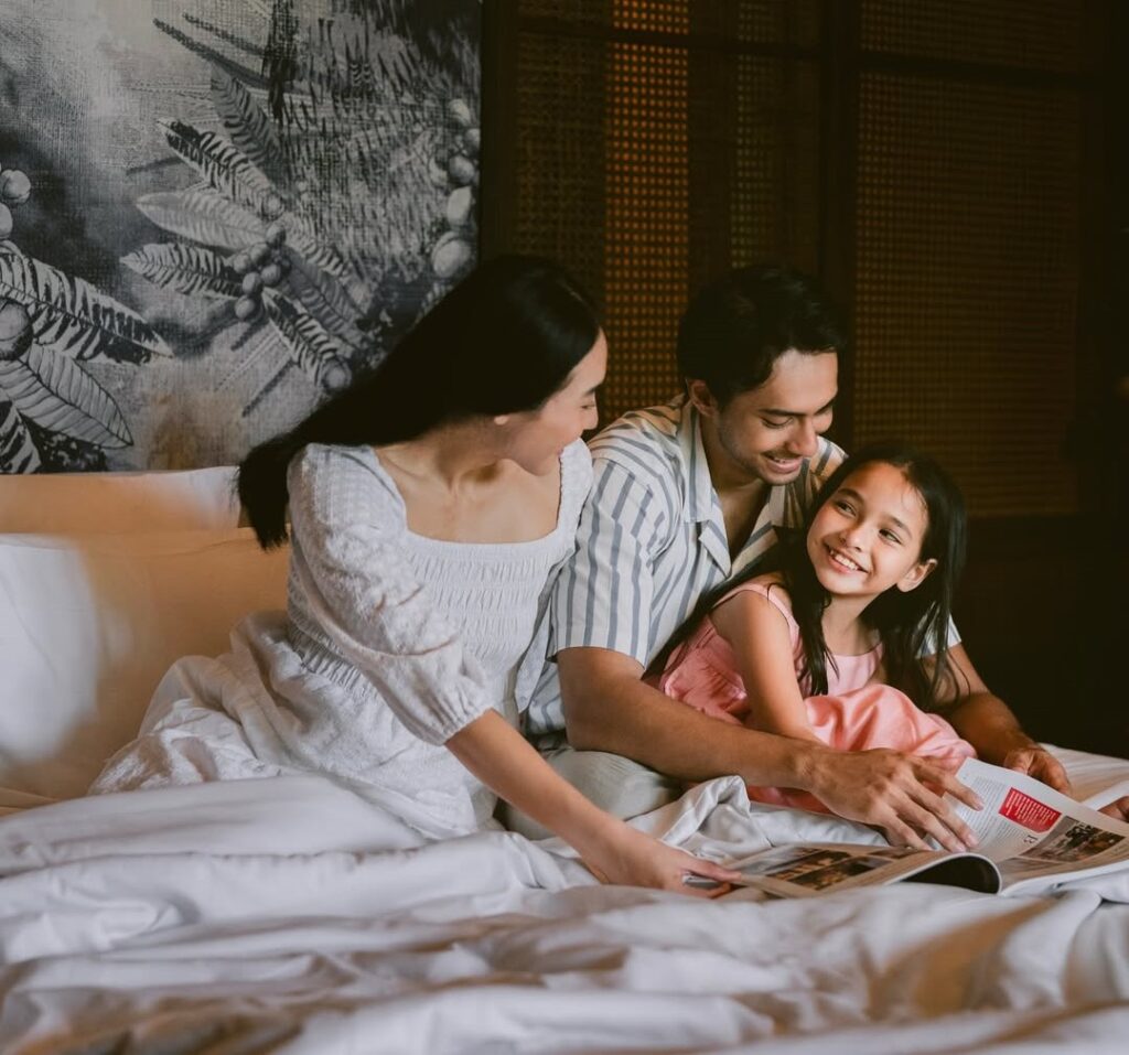 Families enjoying resort activities by the beach, illustrating the variety of experiences at all-inclusive resorts in Sanur Bali.