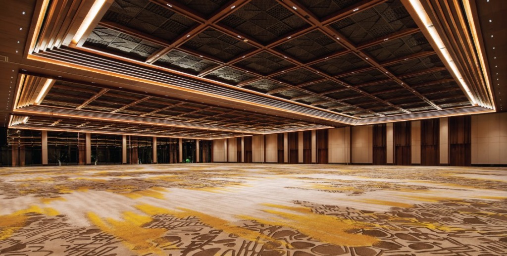 A Beachfront Wedding in Sanur Bali Defined by Elegance and Privacy 23 Wedding guests seated by the shore during a golden hour beachfront wedding Sanur Bali with panoramic sea views.