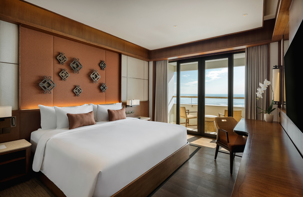 Spacious ocean-view suite with soft neutral interiors and natural light, reflecting the comfort of the best area to stay in Bali for relaxation.