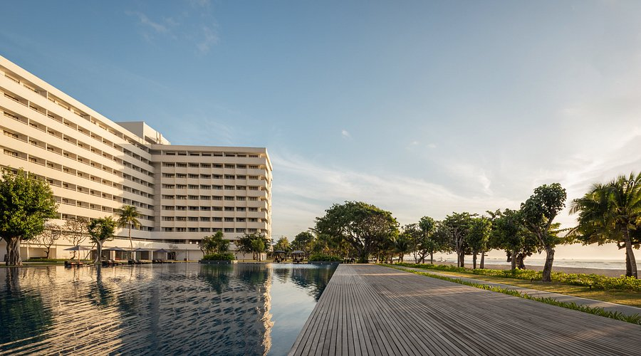 Spacious ocean-view suite with private balcony overlooking calm waters, representing the comfort of the best beach resorts in Sanur Bali.