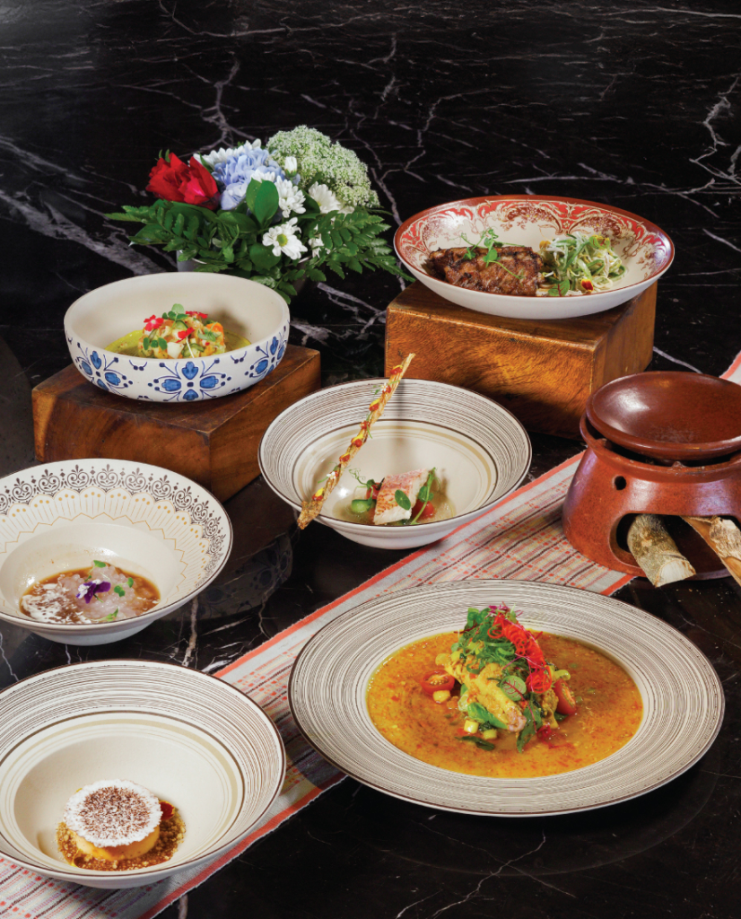 Best Restaurants in Sanur Bali: A Curated Guide to Local and Fine Dining 19 Oceanfront dining terrace at sunset with fresh seafood dishes, highlighting the best restaurants in Sanur Bali for a scenic meal.