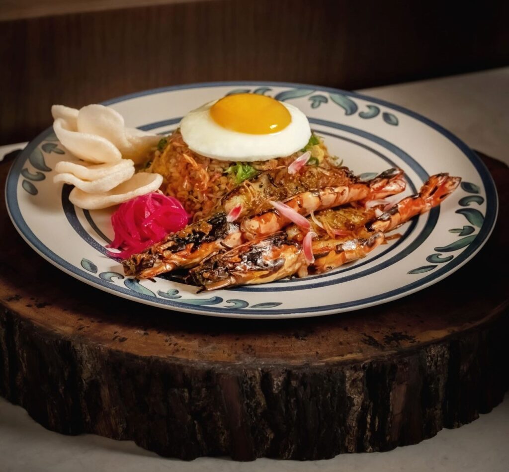 Best Restaurants in Sanur Bali: A Curated Guide to Local and Fine Dining 21 Colorful seafood platter served by the beach, showcasing popular dishes at the best restaurants in Sanur Bali.