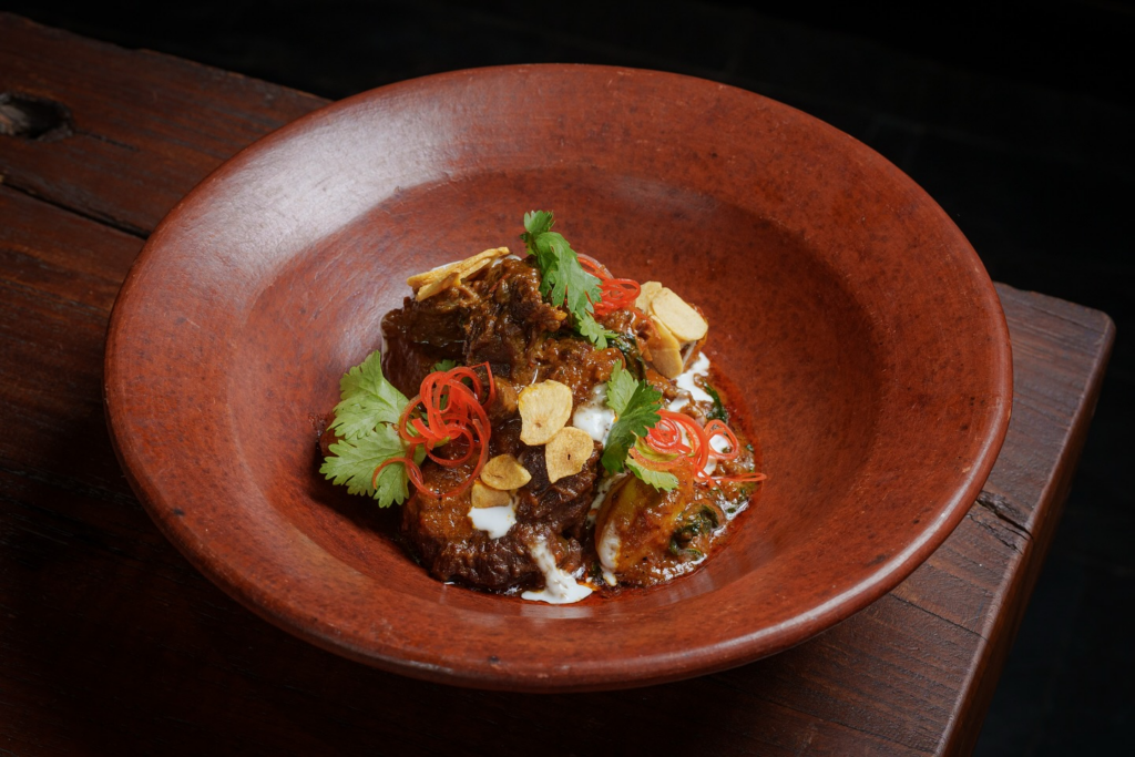 Luxury Restaurants in Sanur, Bali: Elegant Coastal Dining Experiences 20 Fine dining table with gourmet seafood dishes and candlelight, representing the experience at luxury restaurants in Sanur Bali.