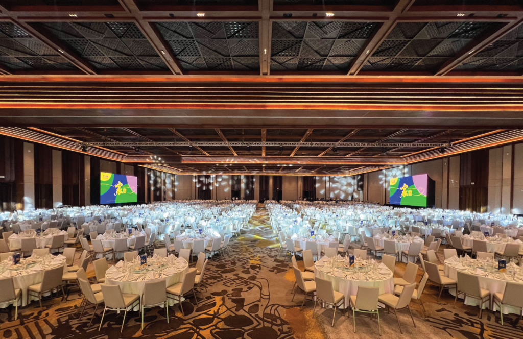 Lavish seaside reception with stage lighting and tropical décor, illustrating grand luxury weddings Sanur Bali events.