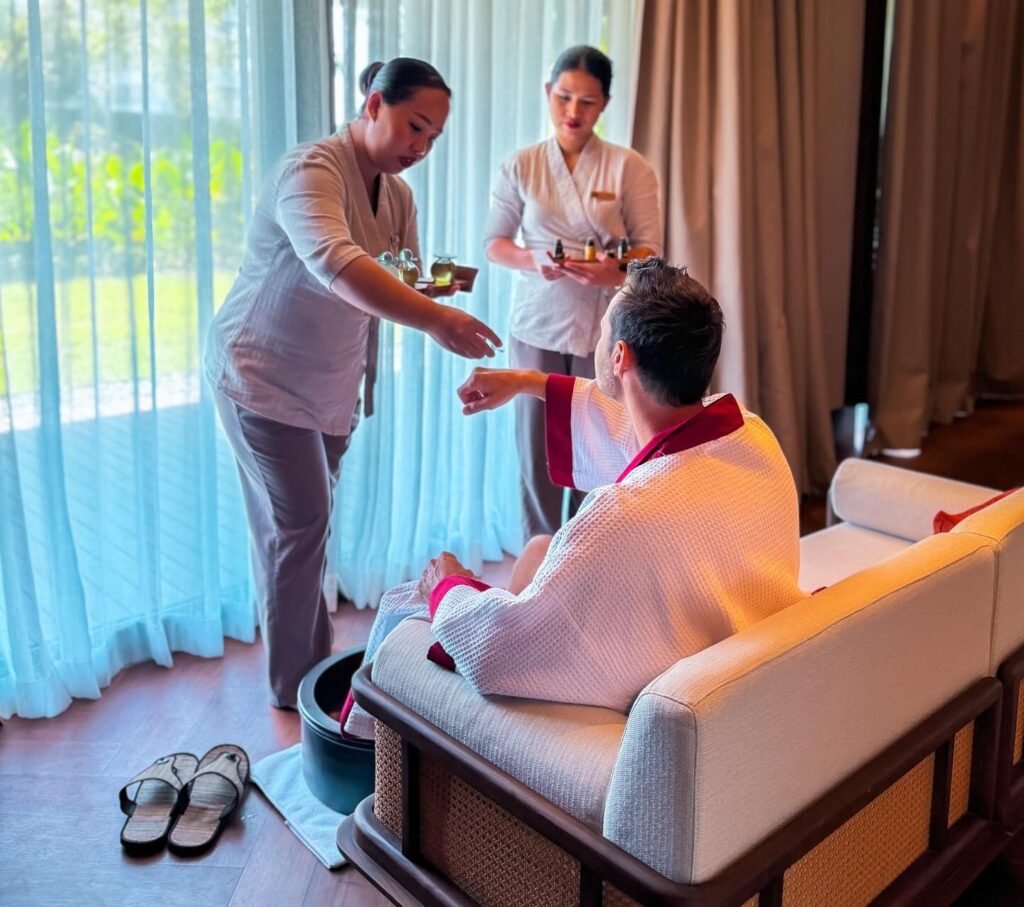 Serene yoga session at sunrise overlooking tropical greenery, capturing the essence of a transformative wellness retreat in Bali.