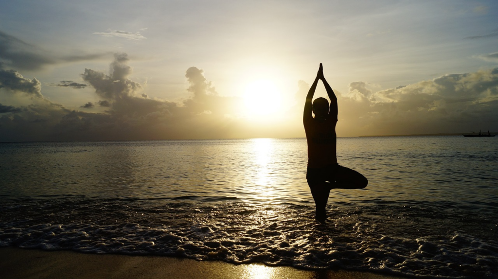 Explore 10 Best Wellness Retreats in Sanur Bali 2026 22 Sunrise yoga session by the calm shoreline, capturing the peaceful atmosphere of wellness retreats in Sanur Bali.