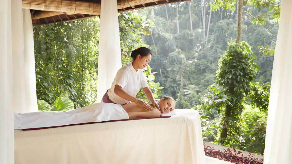 Explore 10 Best Wellness Retreats in Sanur Bali 2026 40 Guided meditation class in a tropical garden setting, showcasing mindful experiences at wellness retreats in Sanur Bali.