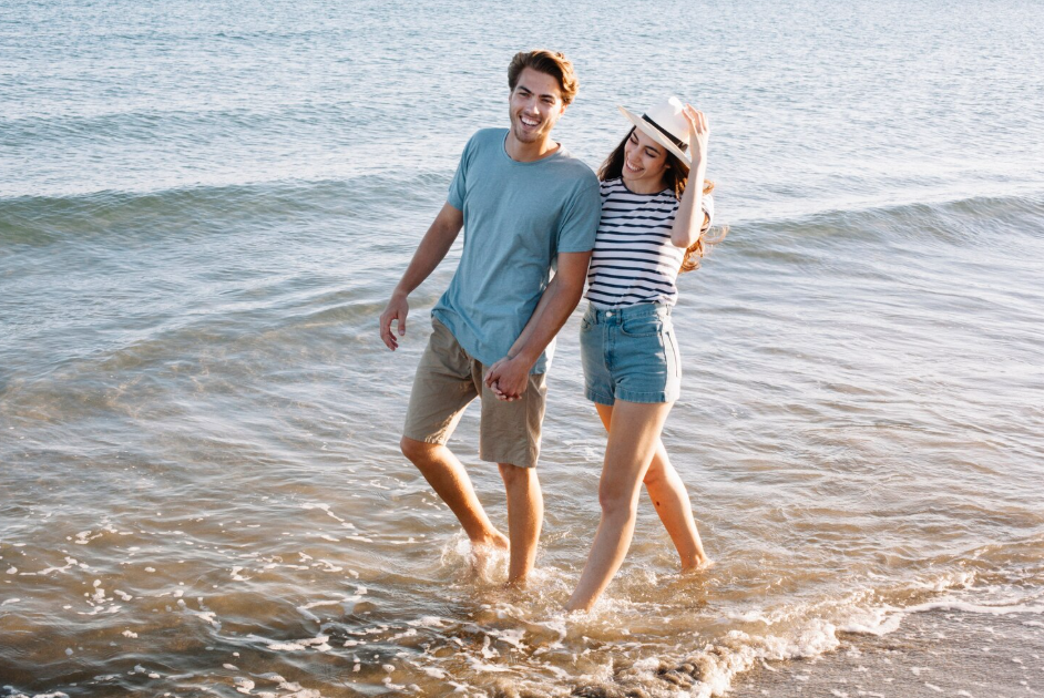 Couples enjoying a beachfront walk while exploring what to do in Sanur Bali for couples
