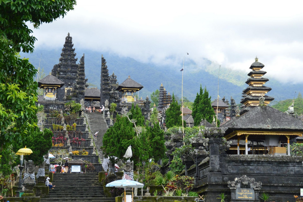 Besakih Temple on the slopes of Mount Agung, featuring traditional Balinese architecture and dramatic mountain views.