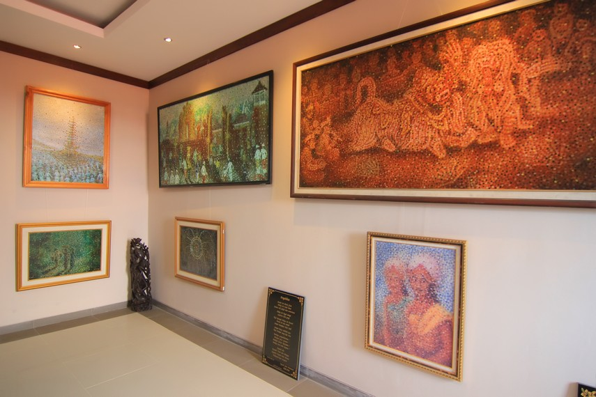 Interior of the Fingerprint Painting Museum in Bali, displaying colorful artworks created using unique fingerprint painting techniques.